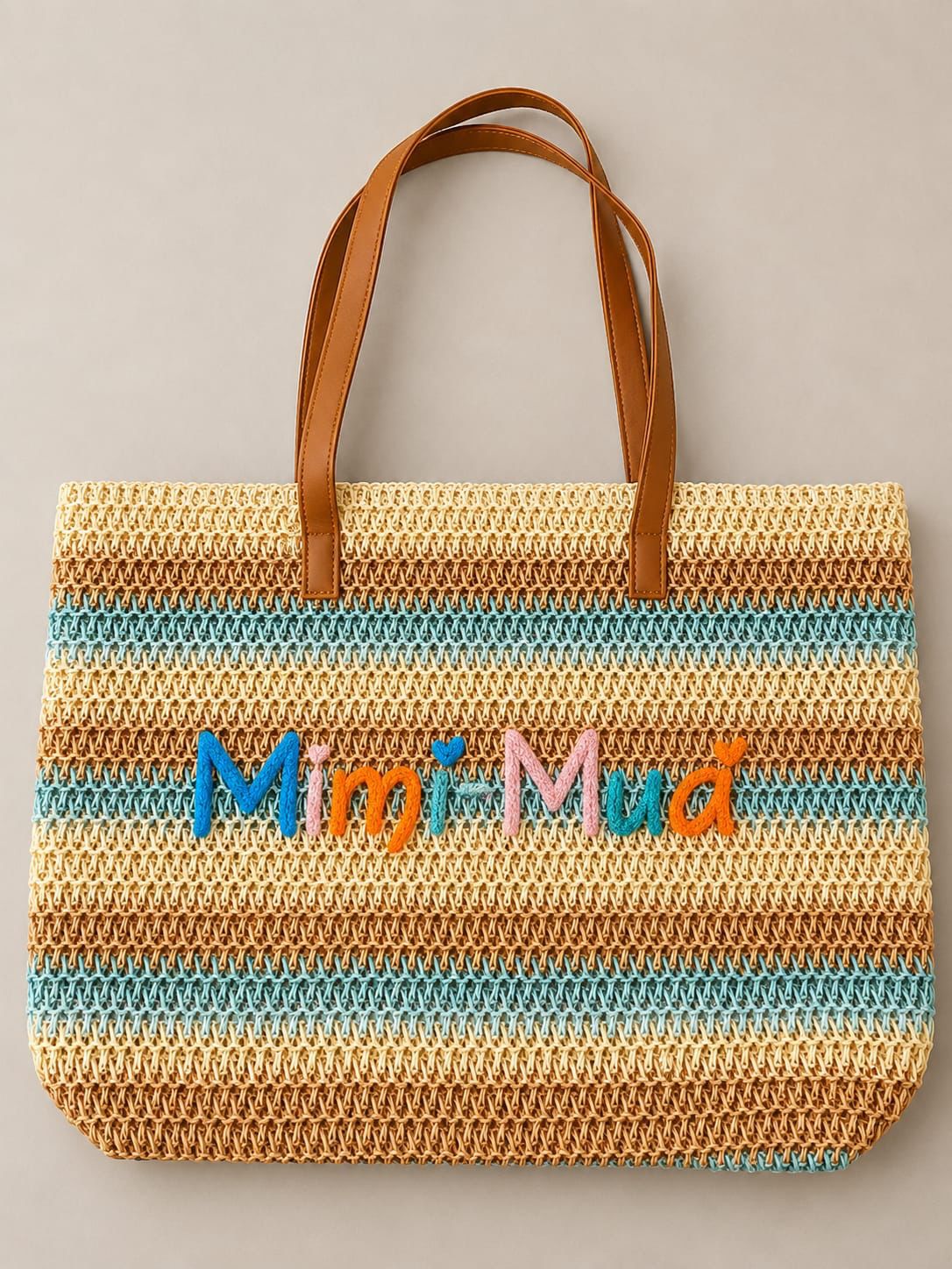 Borsa maxi in fantasia con zip e ricamo centrale