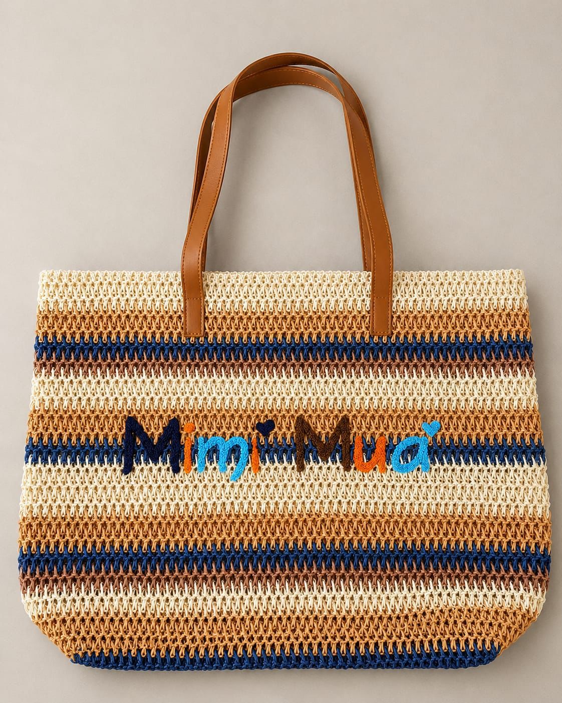 Borsa maxi in fantasia con zip e ricamo centrale
