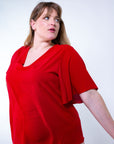 Blusa con scollo a V e manica a giglio